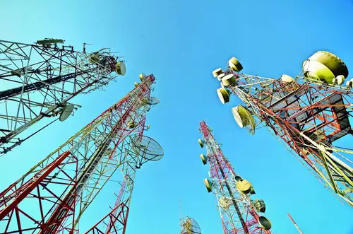 The Indian telecom industry's gross revenue surged 87% to Rs 2.39 lakh crore in FY24, driven by the launch of services by Reliance Jio. Jio and Bharti Airtel gained subscribers at the expense of Vodafone Idea. The two top telcos now control 78% of sectoral revenue, expected to rise to 83% by FY26. Vi's revenue market share fell to 15.7%, while Airtel and Jio saw revenue growth, with Jio leading at 41.4% RMS.