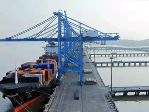 Jawaharlal Nehru Port (JNPA) is set to expand its container handling capacity to 10 million TEUs by April next year, announced Union Minister Sarbananda Sonowal. The port will also develop new liquid cargo berths under a Public-Private Partnership model, increasing its capacity to 11 MMTPA. Recent developments include the signing of MoUs, increased revenue from e-auctions, and the issuance of Letters of Intent to SEZ concessionaires. Additionally, a WhatsApp chatbot for local workforce development was launched, reflecting the port's commitment to improved infrastructure and eco-friendly operations.