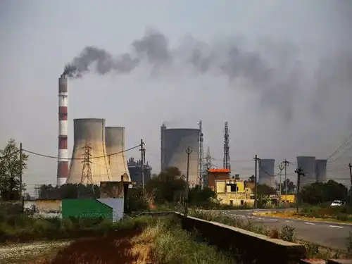 India's power industry emissions must peak by 2026 to achieve net zero by mid-century, according to BloombergNEF. However, the government's push for coal usage makes this target unlikely. India needs $12.4 trillion in investment for clean energy, electric vehicles, and new technologies like carbon capture and green hydrogen.