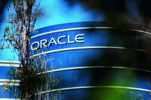 Oracle shares rose more than 10% on Tuesday as a push to embed AI into its cloud service products boosted its first-quarter results and helped it narrow the gap with market leaders.