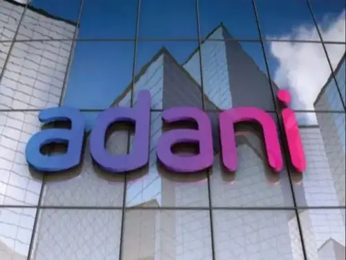 Adani Enterprises Ltd. and Wilmar International Ltd. plan to sell a 13% stake in their joint venture Adani Wilmar Ltd. to comply with Indian securities laws. The sale, valued at $735 million, aims to reduce their combined shareholding from 88% to 75% by February.