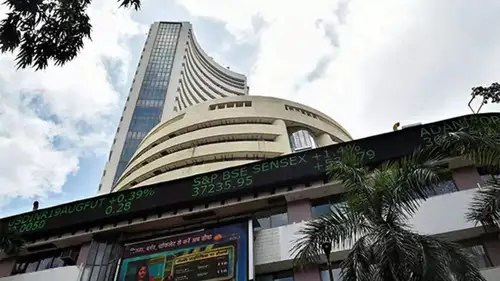 As the US Fed meeting starts, Sensex and Nifty opened flat; FMCG stocks rose, while Tata Motors dropped after a block deal.