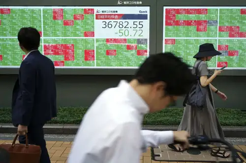 Japan's Nikkei share average reached its highest closing level in over two weeks, driven by exporters as the yen weakened against the dollar. The broader Topix also rose, with significant gains in Toyota and Honda. All industry sub-indexes on the Tokyo Stock Exchange traded higher, with shipping firms and the insurance sector performing strongly.