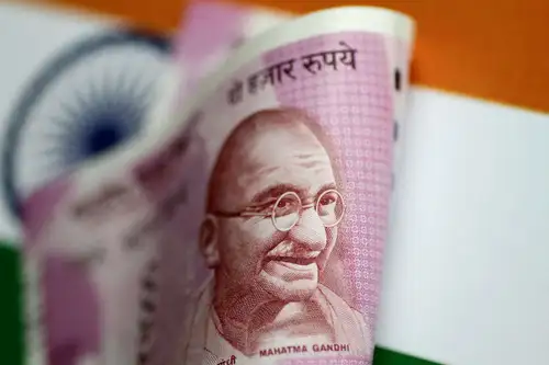 The Indian rupee reached a two-month high, driven by portfolio inflows and a rally in the Chinese yuan following the Federal Reserve's interest rate cut. The rupee closed at 83.68 against the U.S. dollar, with India's equity indices also seeing gains.