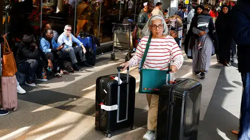 A strike at Nairobi airport has led to significant flight delays and cancellations. Workers protest against a proposed 30-year lease to Adani Group.